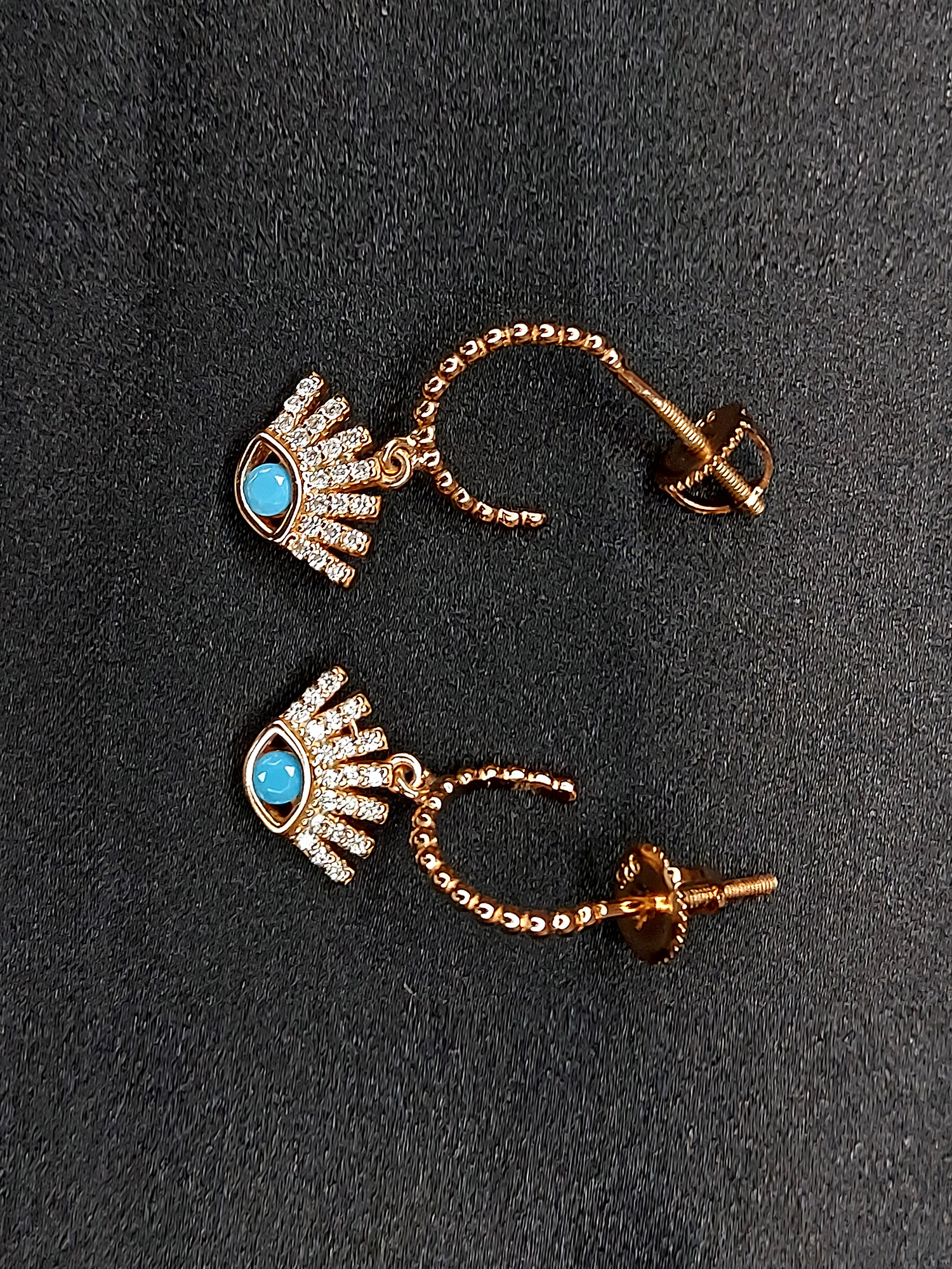 Silver rose gold evil eye earring