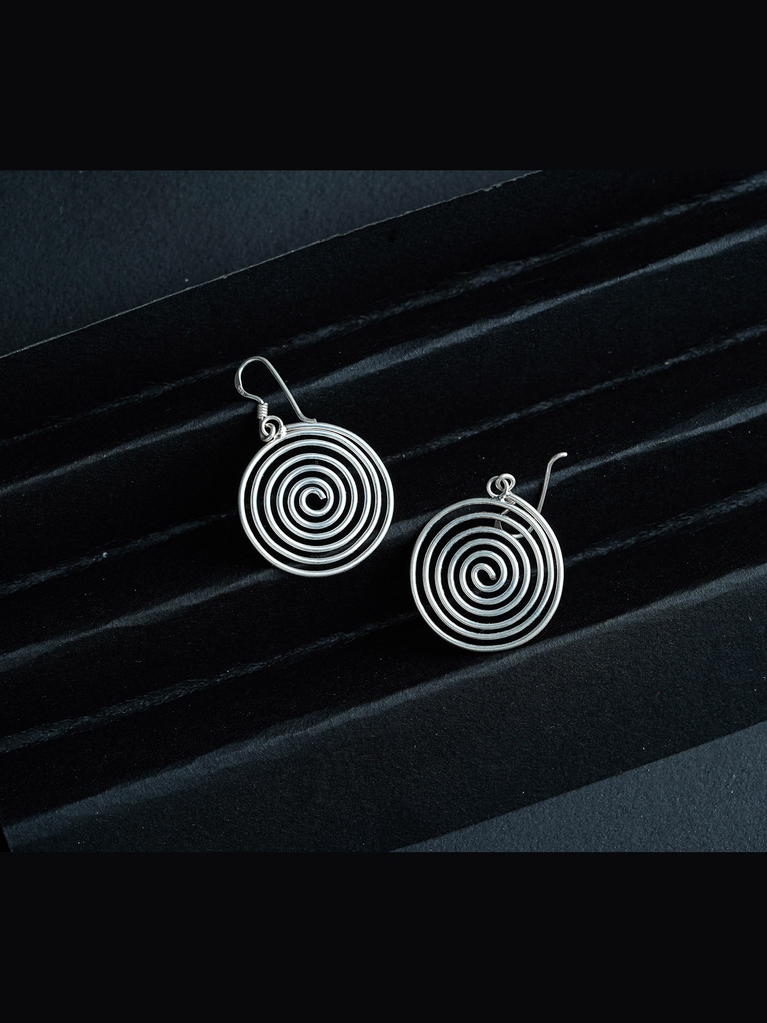 Silver spiral round earring