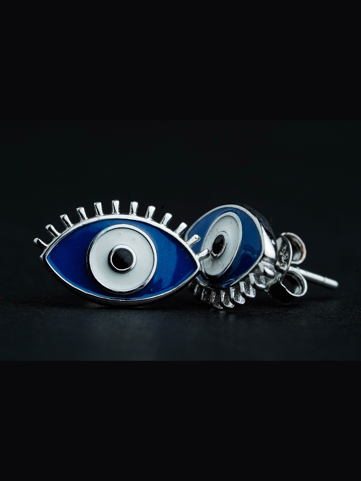 Silver evil eye earring